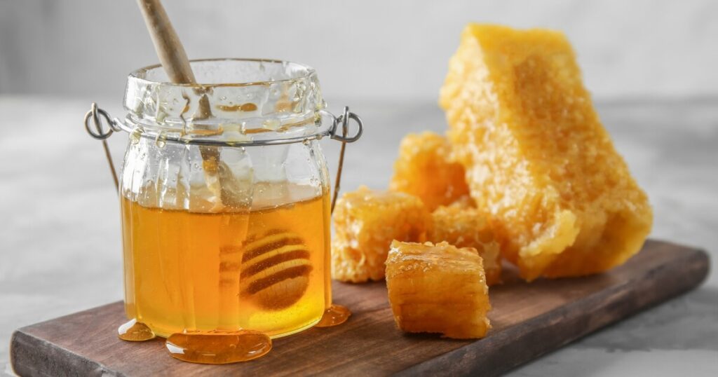 natural raw honey and honey comb