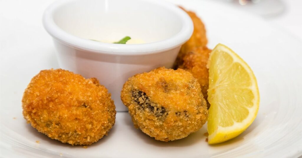conch fritters with sauce lemon
