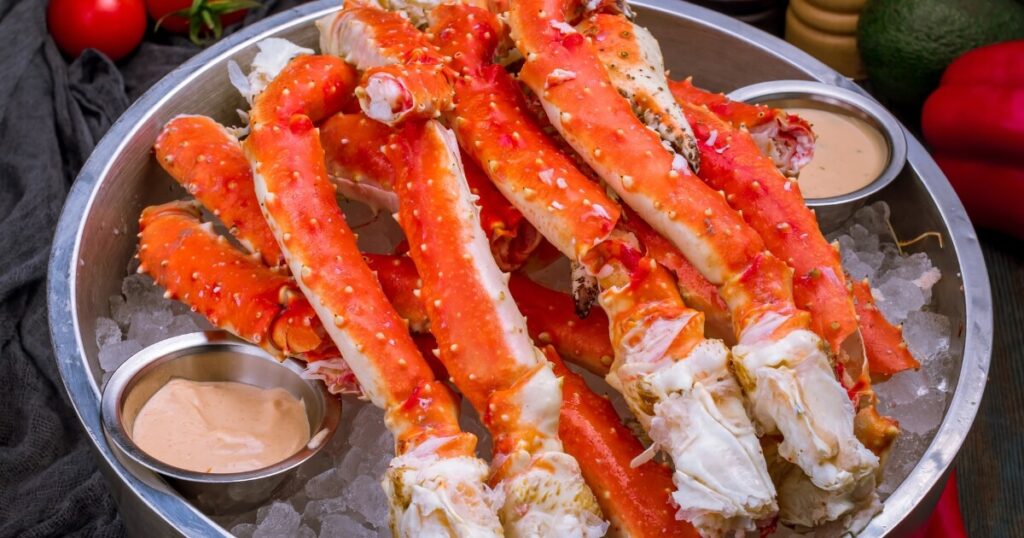 cooked king crab legs on ice
