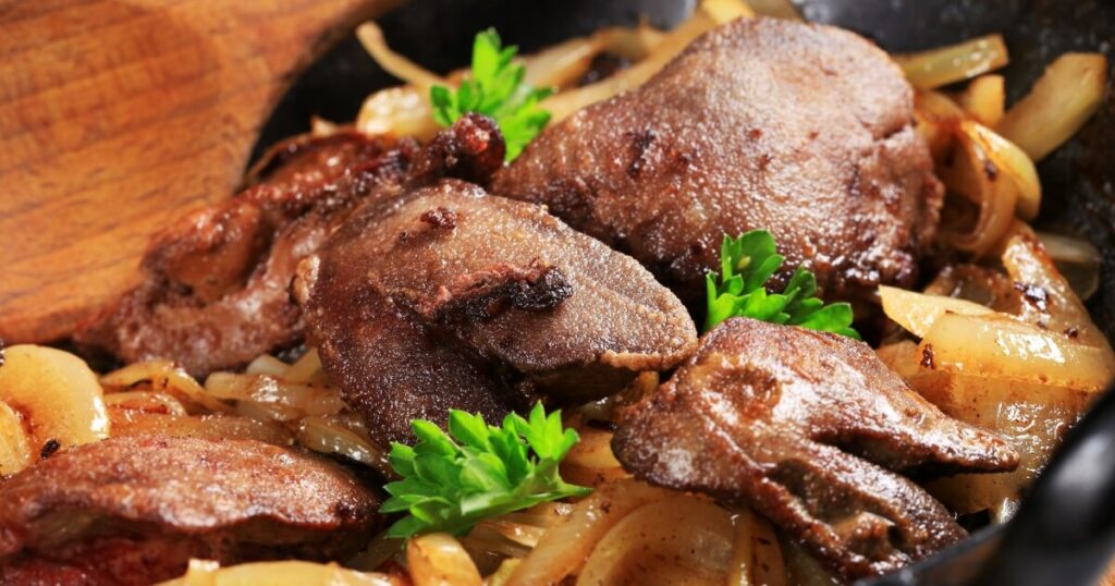 fresh fried livers with onions in pan